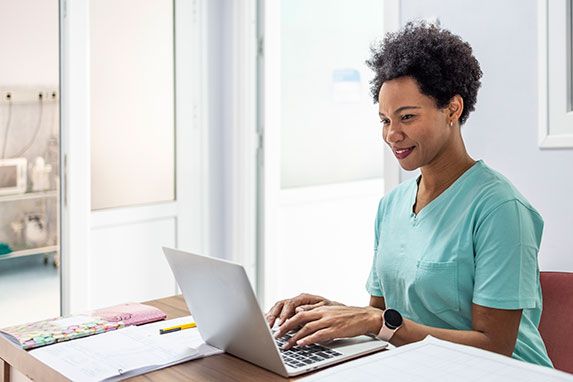 medical female on laptop.