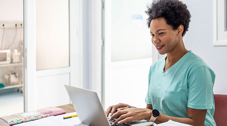 medical professional on computer.
