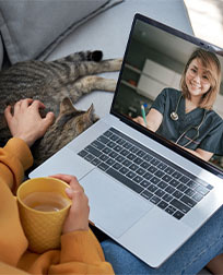 A client and her cat during a telehealth appointment.
