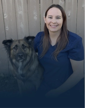 Penn Foster vet tech student, Kelsy, with dog.