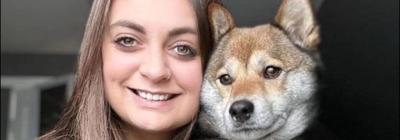 Penn Foster Vet Tech student taking selfie with dog.