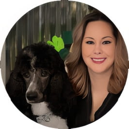 Penn Foster graduate posing with poodle. 